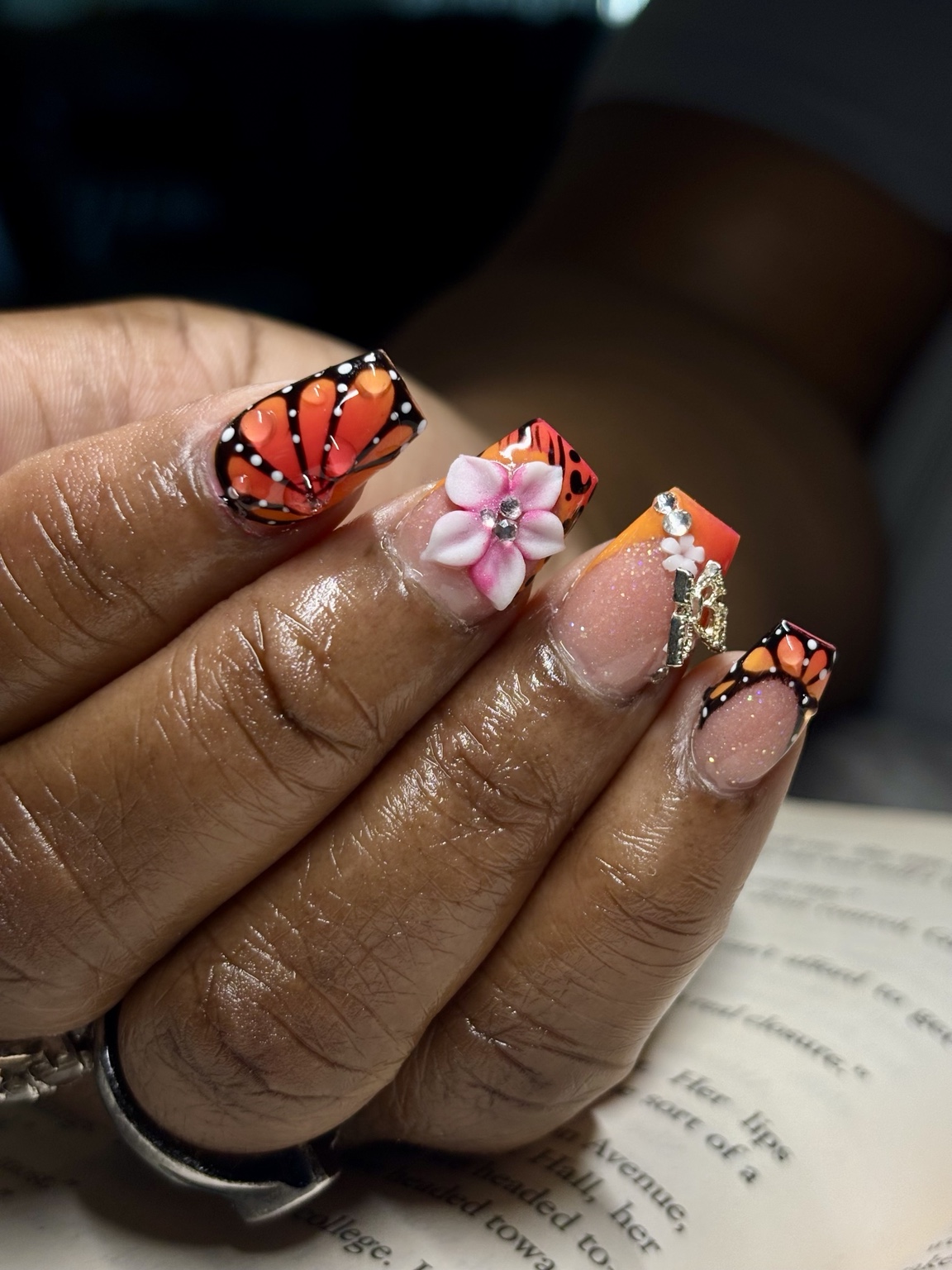 Custom orange butterfly nail set by Alaia Monèt