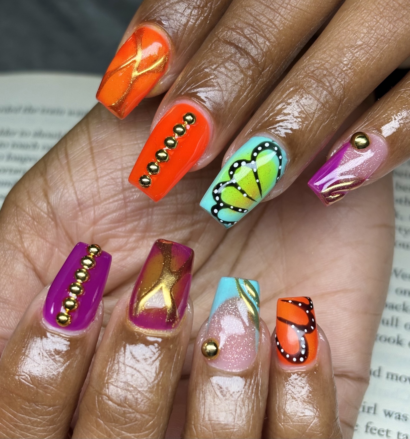 Custom colorful butterfly nail art by Alaia Monèt