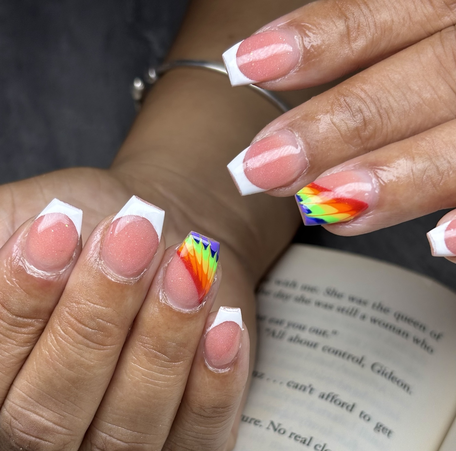 Custom rainbow French nail art by Alaia Monèt